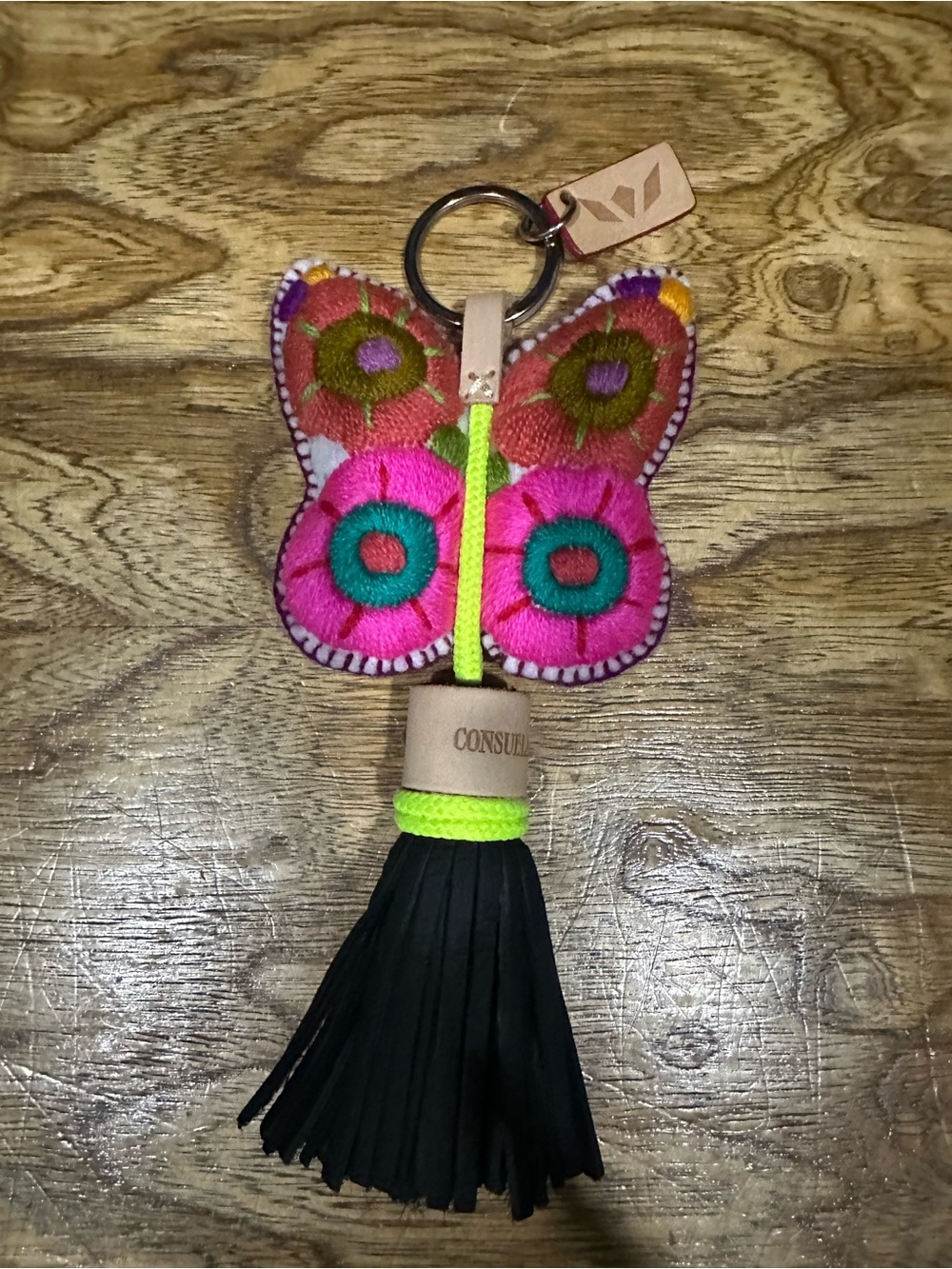 New Consuela butterfly charm with leather tassel